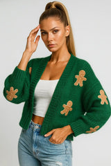 Green knitted cardigan with gingerbread appliqués — cozy holiday women’s sweater